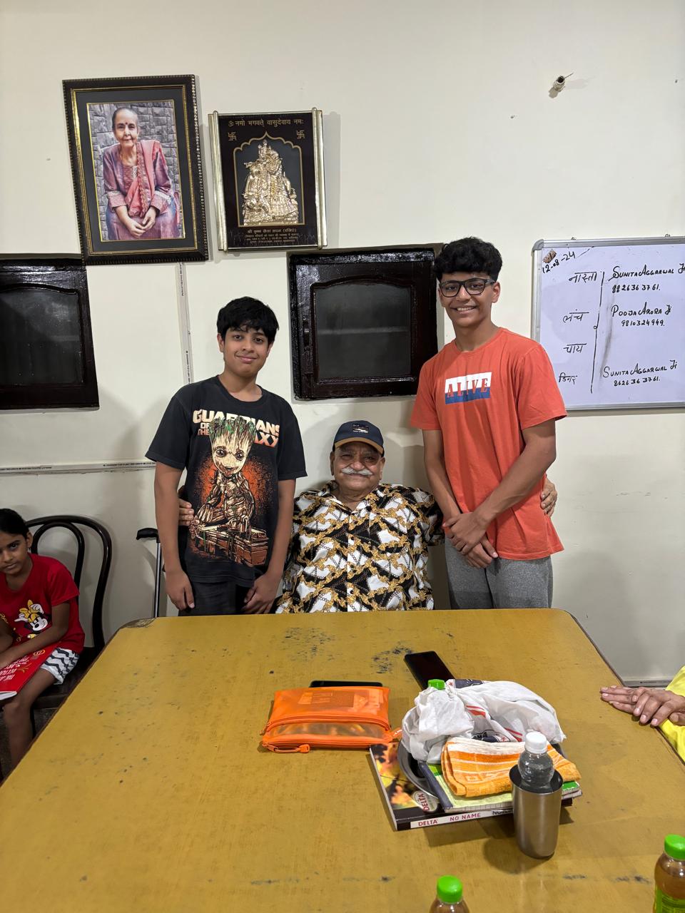 Team members talking with a resident at an elderly care home