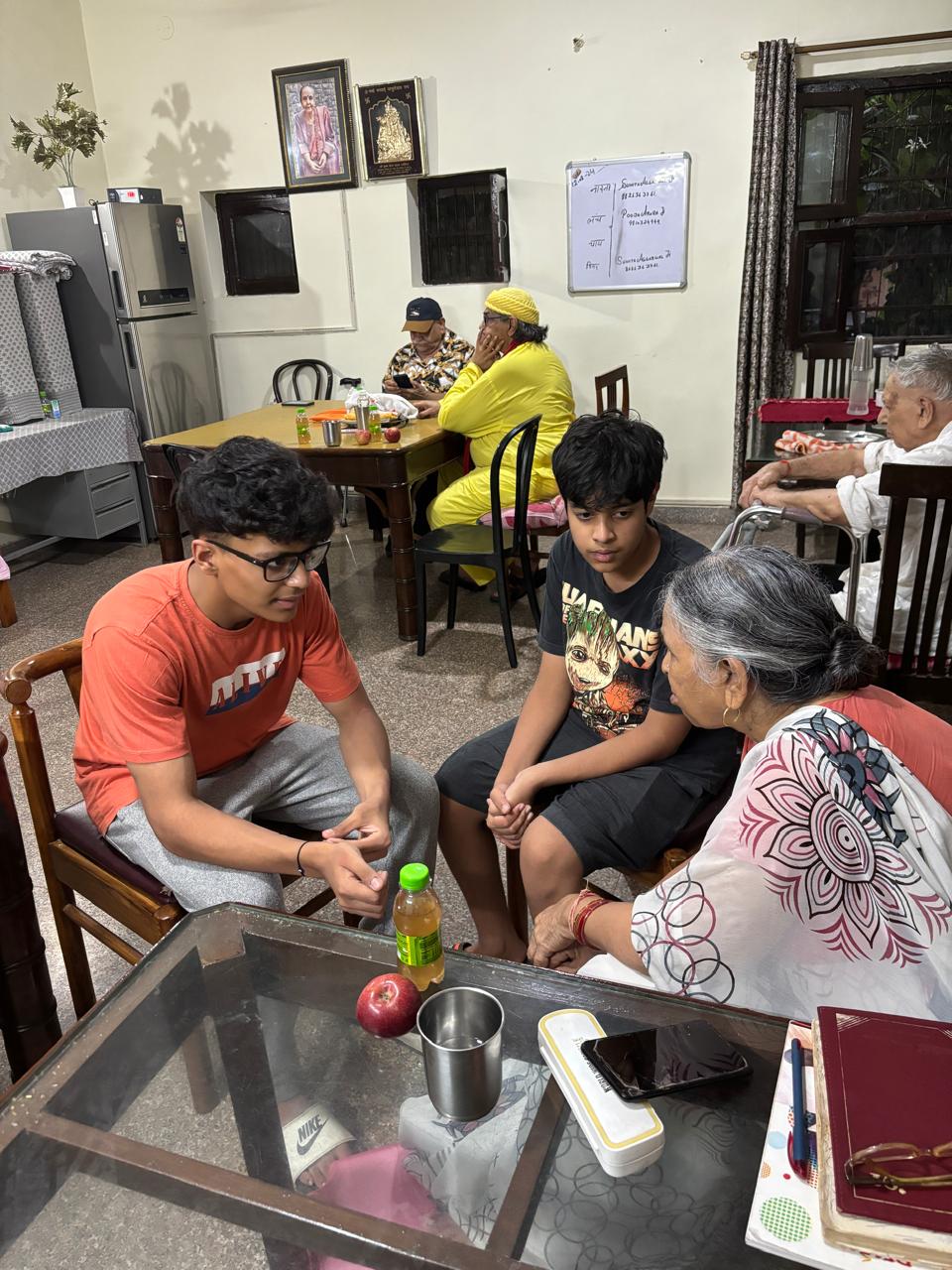 Students meeting elderly care-home residents